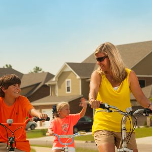 Mother and children biking | New Park