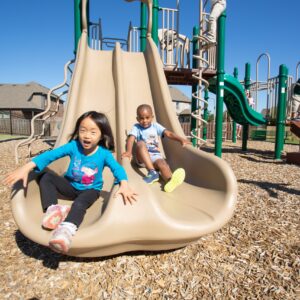children going down slide | New Park