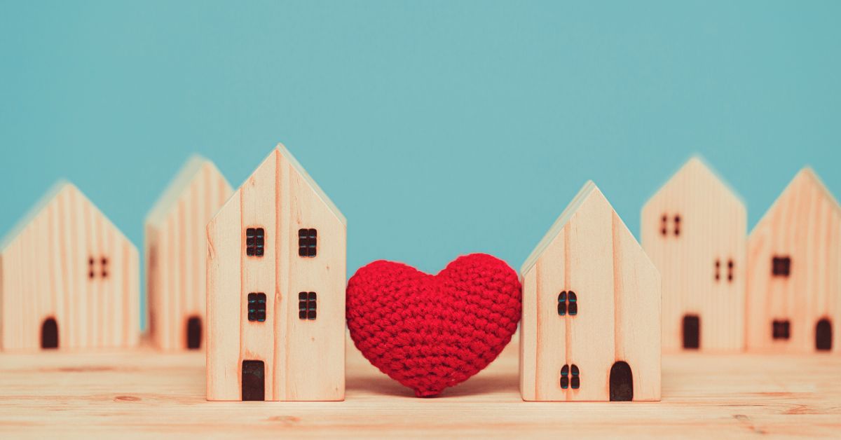 wooden houses with a heart between them