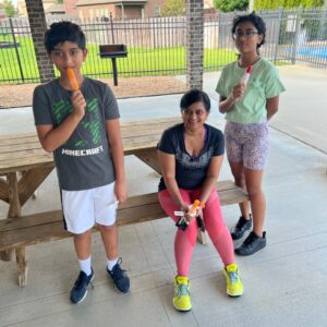 A group of young children standing next to a fence | New Park